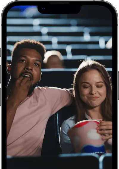 two people eating popcorn